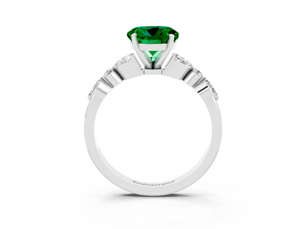 Platinum Round Cut Emerald Solitaire Ring with Side Stones and Four-Prong Setting