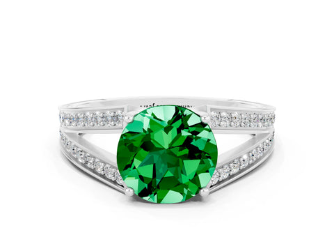 White gold Round Cut Emerald Split Shank Ring with Pavé Band and Four-Prong Setting