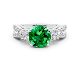 White gold Round Cut Emerald Three-Stone Ring with Pavé Split Shank and Four-Prong Setting