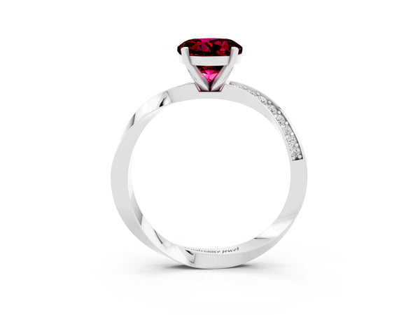 Platinum Round Cut Garnet Engagement Ring with Side Stone Accents and Four-Prong Setting