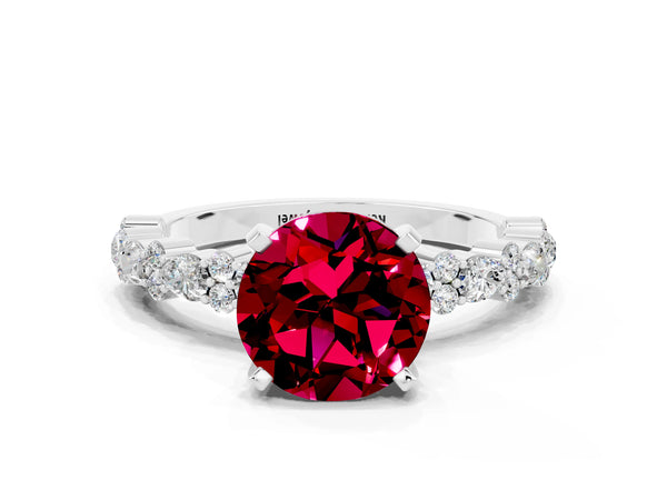 Silver Round Cut Garnet Side Stone Solitaire Ring with Round  and Four-Prong Setting