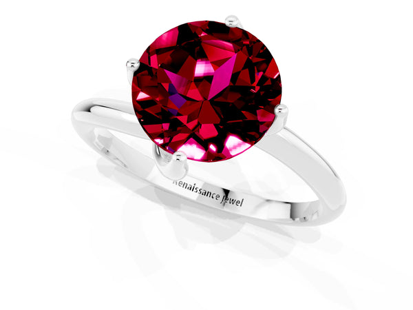 Silver Round Cut Garnet Solitaire Engagement Ring with Four-Prong Setting and Classic Band