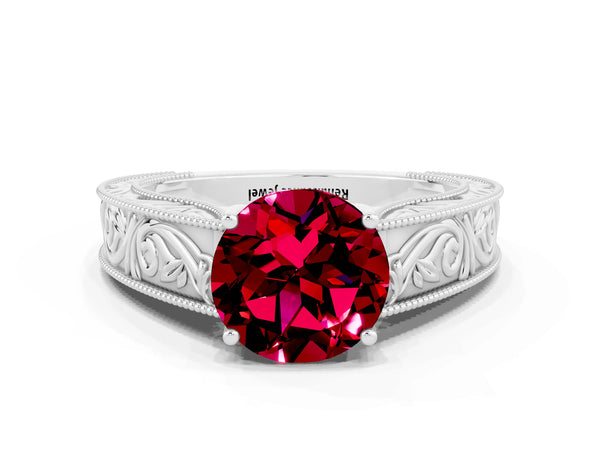 Platinum Round Cut Garnet Solitaire Ring with Engraved Band and Four-Prong Setting