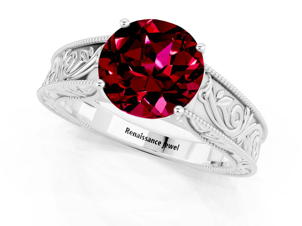 Platinum Round Cut Garnet Solitaire Ring with Engraved Band and Four-Prong Setting