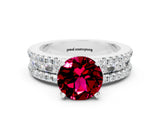 White gold Round Cut Garnet Solitaire Ring with Pavé and Channel Set Band
