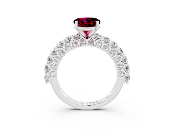 Platinum Round Cut Garnet Solitaire Ring with Shared Prong Pavé Band and Four-Prong Setting