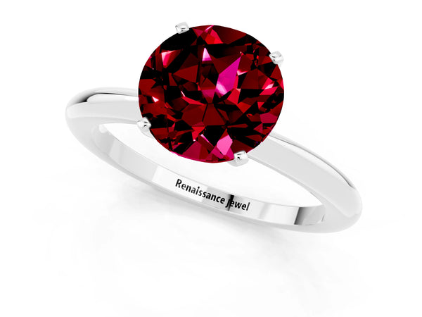 Platinum Round Cut Garnet Solitaire Ring with Six-Prong Setting and Classic Band