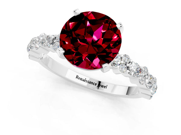 Platinum Round Cut Garnet Side Stone Solitaire Ring with Round  and Four-Prong Setting