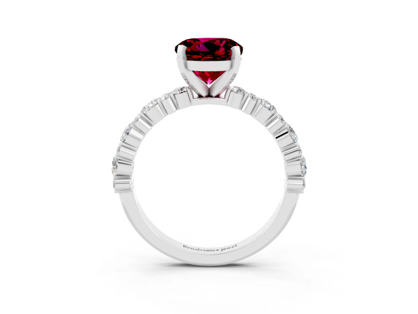 Platinum Round Cut Garnet Side Stone Solitaire Ring with Round  and Four-Prong Setting