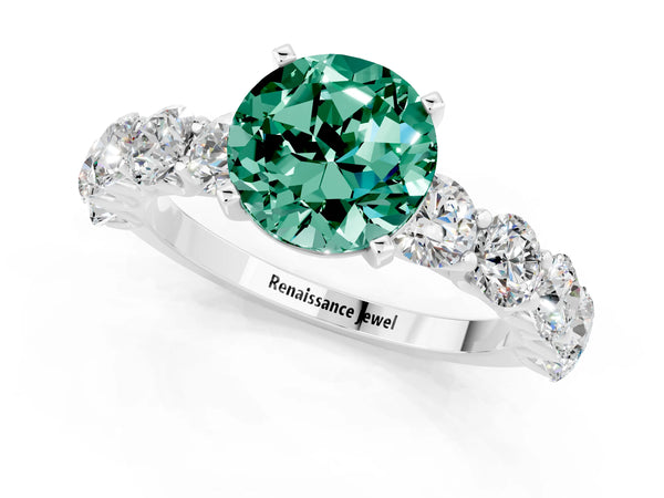 Silver Round Cut Green Sapphire Prong Setting with Side Stones on a Pave Band