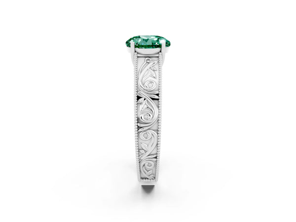 Platinum Round Cut Green Sapphire Solitaire Ring with Engraved Band and Four-Prong Setting