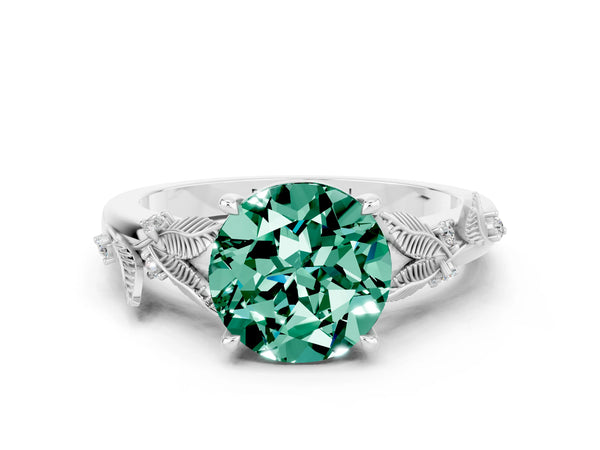 Platinum Round Cut Green Sapphire Solitaire Ring with Leaf Motif Band and Four-Prong Setting