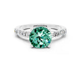White gold Round Cut Green Sapphire Solitaire with Side Baguettes and Channel Set Band