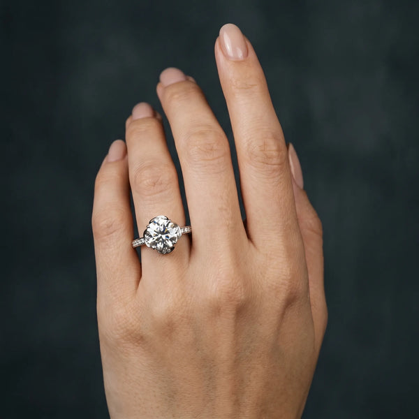White gold Round Cut Halo Diamond Ring with Channel Set Band and Four-Prong Setting
