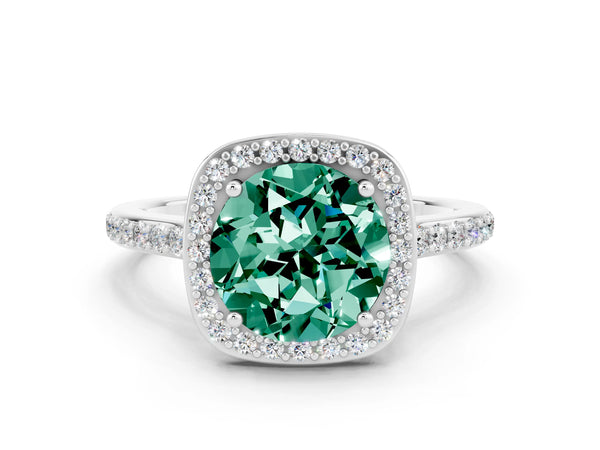 Platinum Round Cut Green Sapphire Halo Engagement Ring with Round Pavé Shoulders and Prong Setting