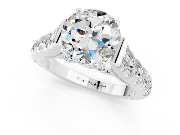 Platinum Round Cut Moissanite Classic Solitaire Ring with Pavé Band and Four-Prong Setting