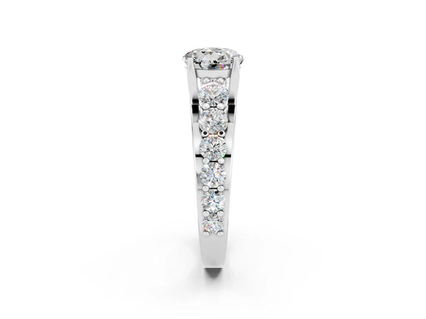 Platinum Round Cut Moissanite Engagement Ring with Pavé Band and Four-Prong Setting