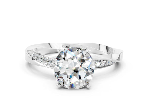 Platinum Round Cut Moissanite Engagement Ring with Side Stone Accents and Four-Prong Setting