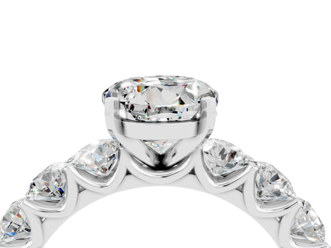 White gold Round Cut Moissanite Prong Setting with Side Stones on a Pave Band_4