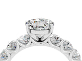 White gold Round Cut Moissanite Prong Setting with Side Stones on a Pave Band_4
