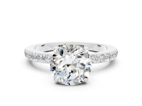 Platinum Round Cut Moissanite Solitaire Engagement Ring with Pavé Band and Four-Prong Setting