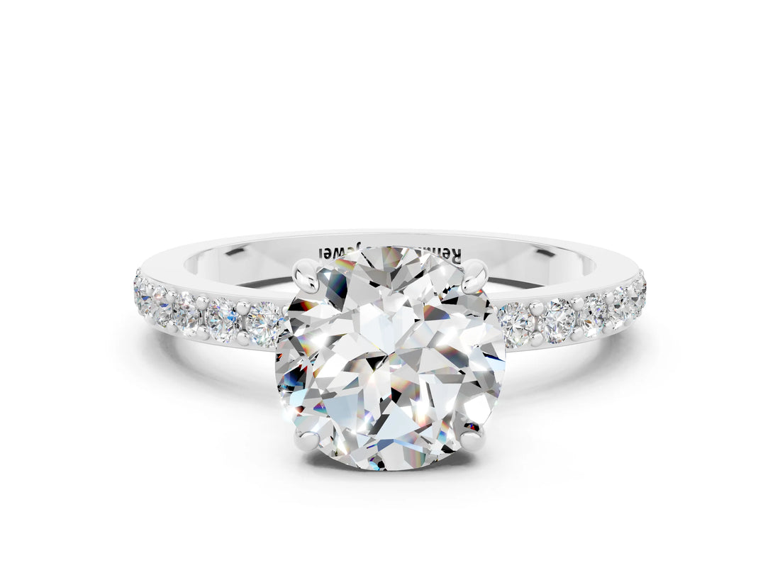 White gold Round Cut Moissanite Solitaire Engagement Ring with Pavé Band and Four-Prong Setting