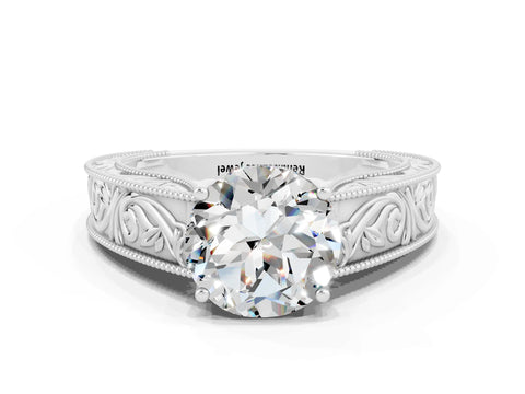 White gold Round Cut Moissanite Solitaire Ring with Engraved Band and Four-Prong Setting