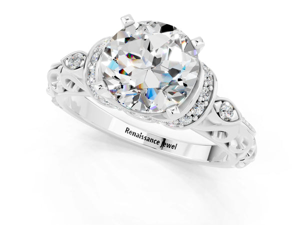 Platinum Round Cut Moissanite Solitaire Ring with Filigree Band and Four-Prong Setting