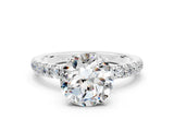White gold Round Cut Moissanite Solitaire Ring with Pavé Accents and Four-Prong Setting