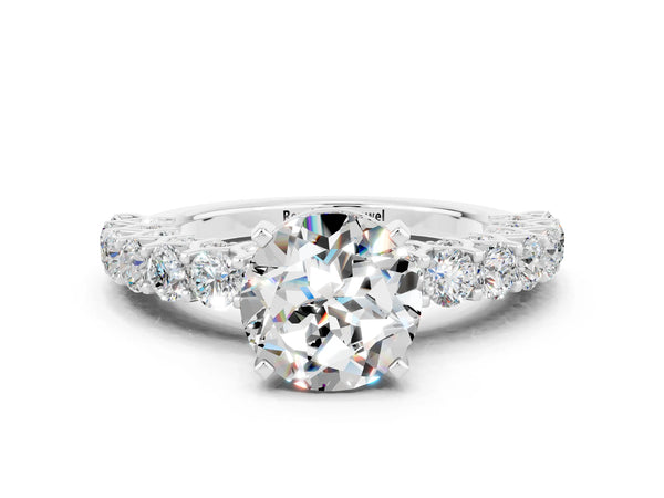 Platinum Round Cut Moissanite Solitaire Ring with Shared Prong Pavé Band and Four-Prong Setting