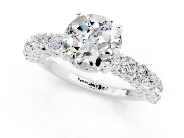White gold Round Cut Moissanite Solitaire Ring with Shared Prong Pavé Band and Four-Prong Setting