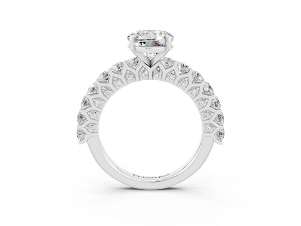 White gold Round Cut Moissanite Solitaire Ring with Shared Prong Pavé Band and Four-Prong Setting