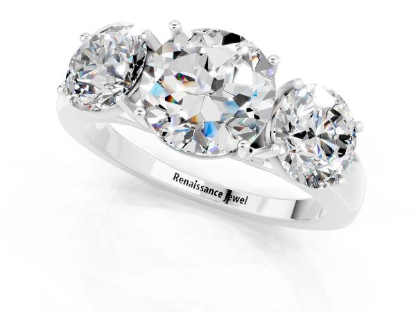 Platinum Round Cut Moissanite Three-Stone Ring with Four-Prong Setting and Classic Band