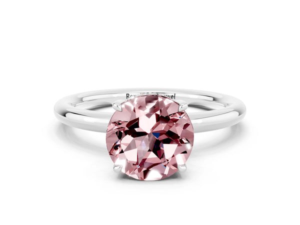 Platinum Round Cut Morganite Solitaire Ring with Thin Band and Four-Prong Setting