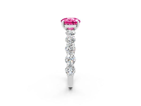 Silver Round Cut Pink Sapphire Prong Setting with Side Stones on a Pave Band