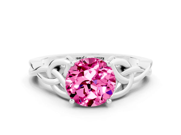 Platinum Round Cut Pink Sapphire Solitaire Engagement Ring with Celtic Knot Band and Four-Prong Setting