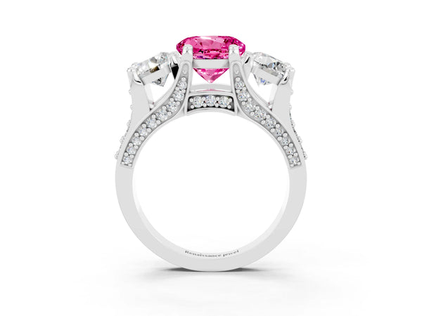 Platinum Round Cut Pink Sapphire Three-Stone Ring with Channel Set Band and Four-Prong Setting