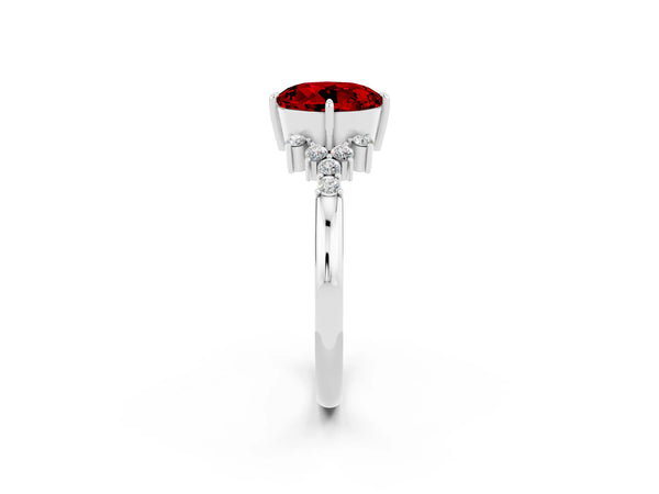 Silver Round Cut Ruby Ring with Side Stones and Four-Prong Setting
