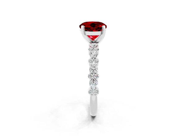 Platinum Round Cut Ruby Side Stone Solitaire Ring with Round  and Four-Prong Setting