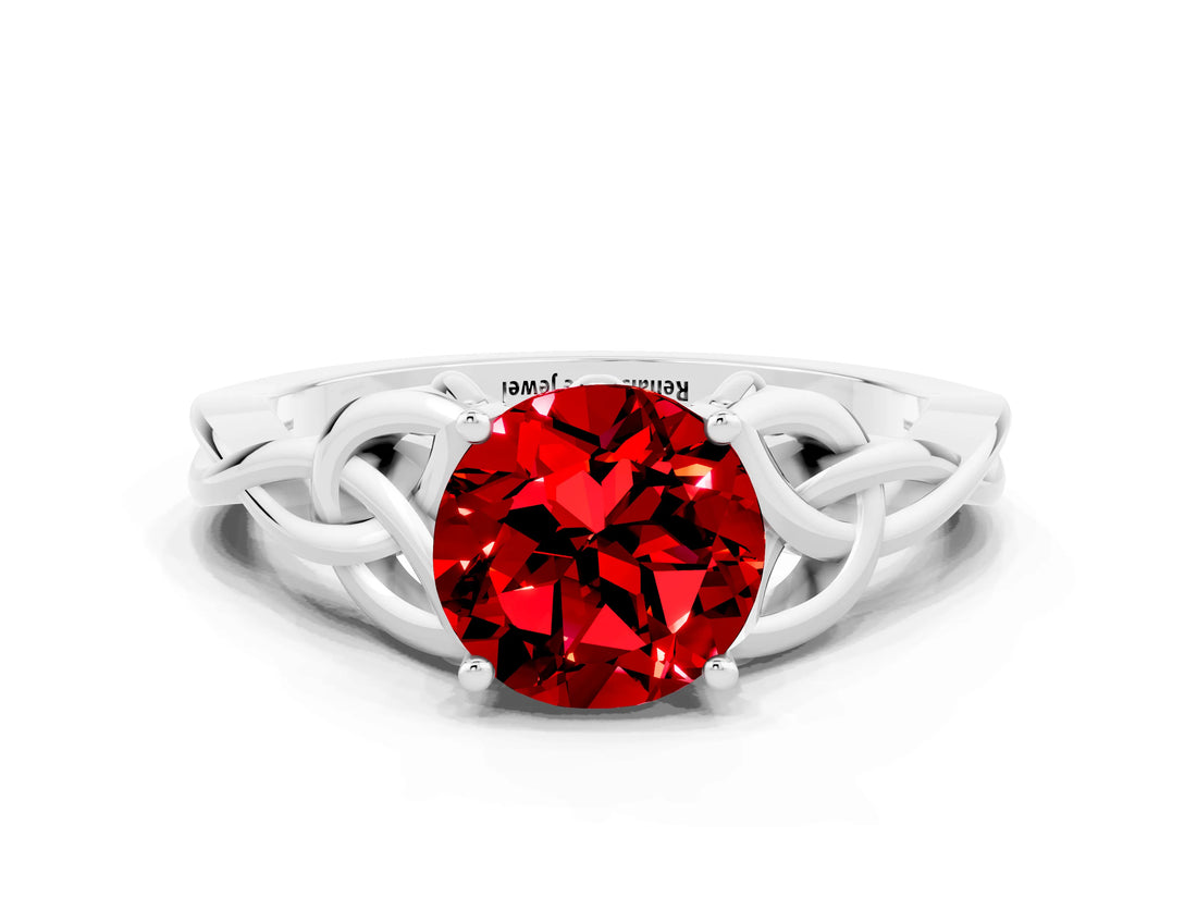 White gold Round Cut Ruby Solitaire Engagement Ring with Celtic Knot Band and Four-Prong Setting