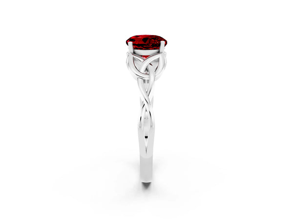 Platinum Round Cut Ruby Solitaire Engagement Ring with Celtic Knot Band and Four-Prong Setting