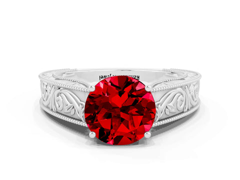 White gold Round Cut Ruby Solitaire Ring with Engraved Band and Four-Prong Setting