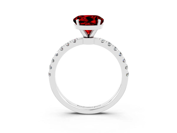 Silver Round Cut Ruby Solitaire Ring with Pavé Accents and Four-Prong Setting