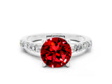 White gold Round Cut Ruby Solitaire with Side Baguettes and Channel Set Band