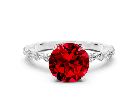 White gold Round Cut Ruby Solitaire with Side Stones on a Pavé Band and Four-Prong Setting