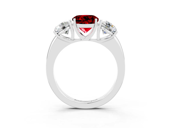 Platinum Round Cut Ruby Three-Stone Ring with Four-Prong Setting and Classic Band