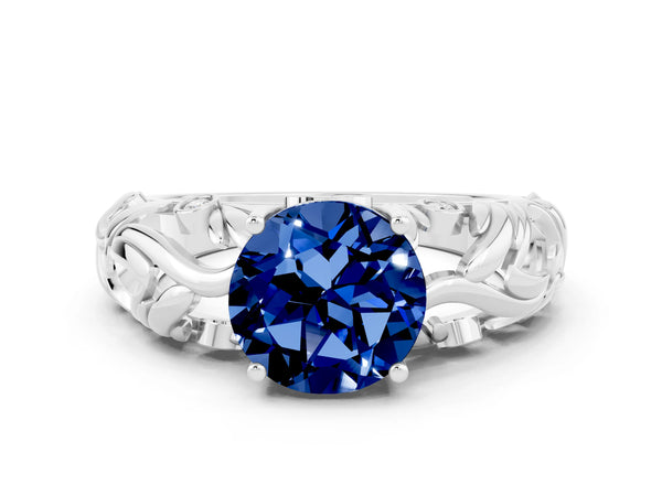 Platinum Round Cut Solitaire Blue Sapphire Leaf-Inspired Vine Band Ring with Prong Setting