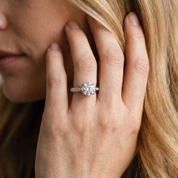 White gold Round Cut Solitaire Diamond Ring with Pavé Band and Six-Prong Setting
