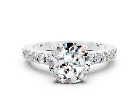 White gold Round Cut Solitaire Diamond with Pavé Band and Four-Prong Setting