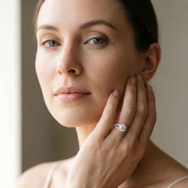 White gold Round Cut Solitaire Diamond with Pavé Twist Band and Four-Prong Setting